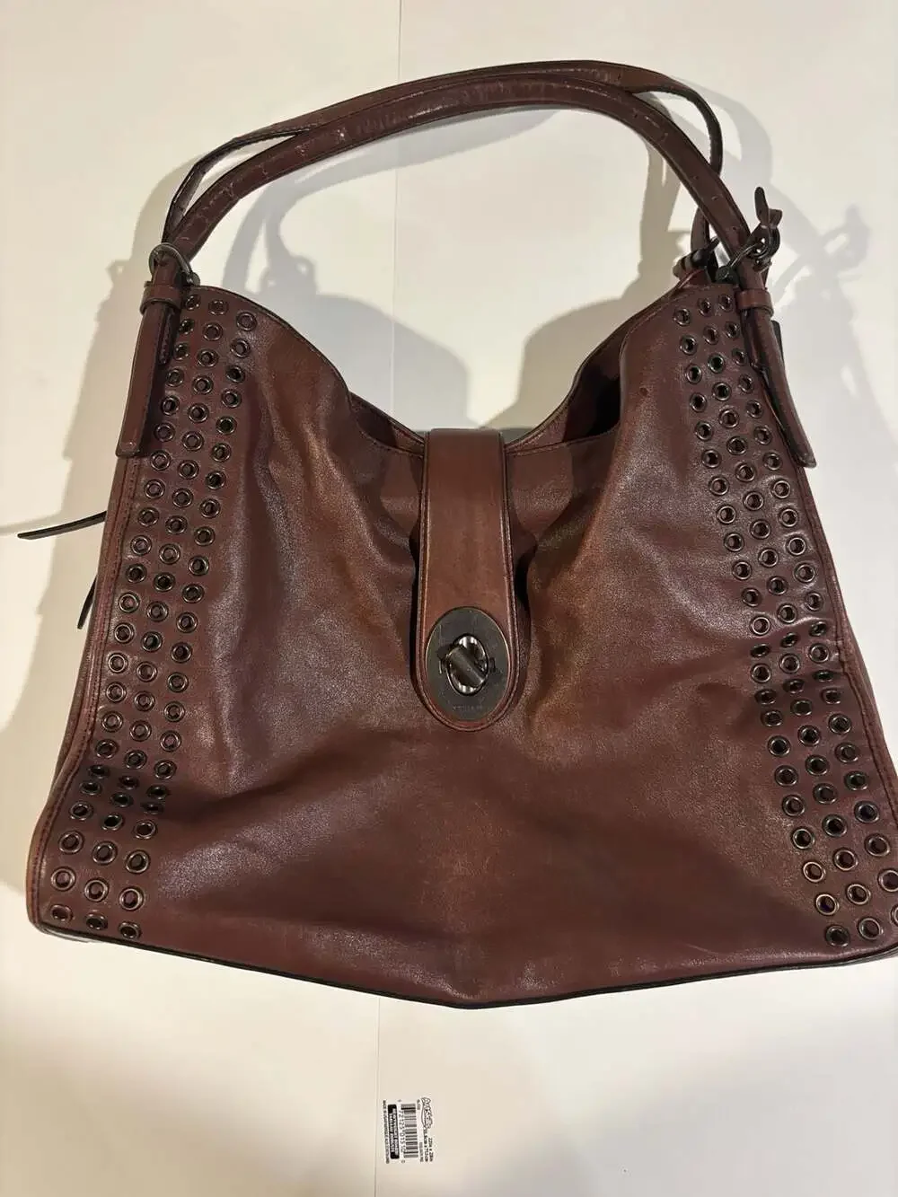 Coach Brown Leather Hobo Shoulder Bag with Grommets and Turnlock Closure